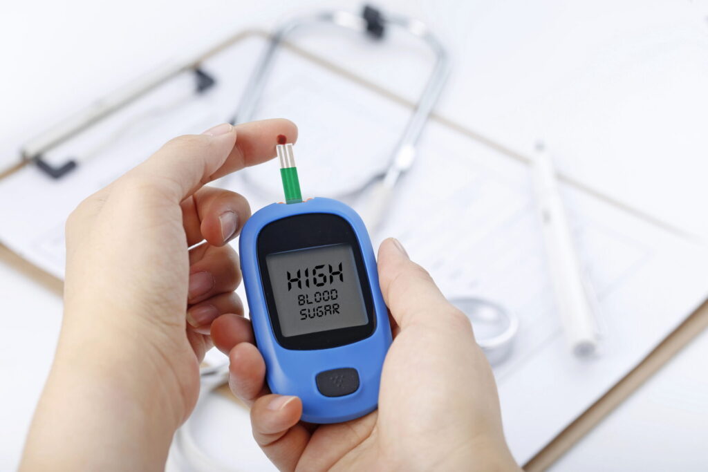 A person checking high blood sugar