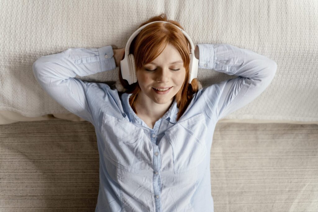 a woman listening to meditation sleep music