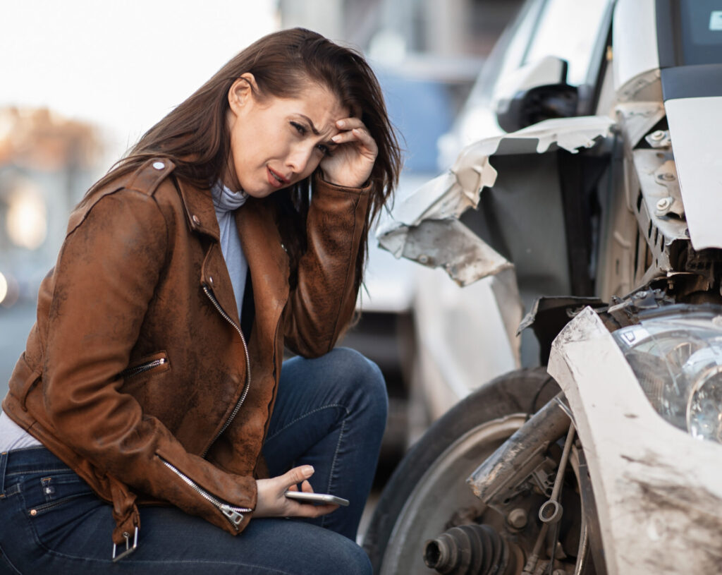 a woman crying because of a car accident