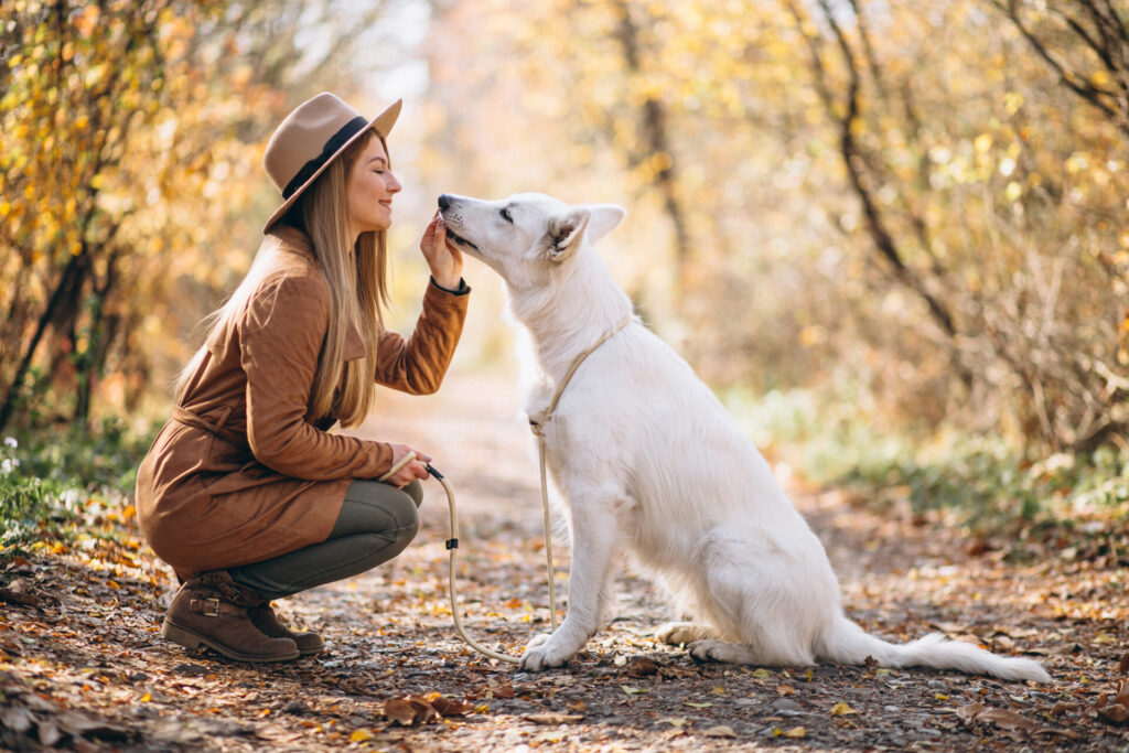 a woman feeling peaceful and relaxed with her dog